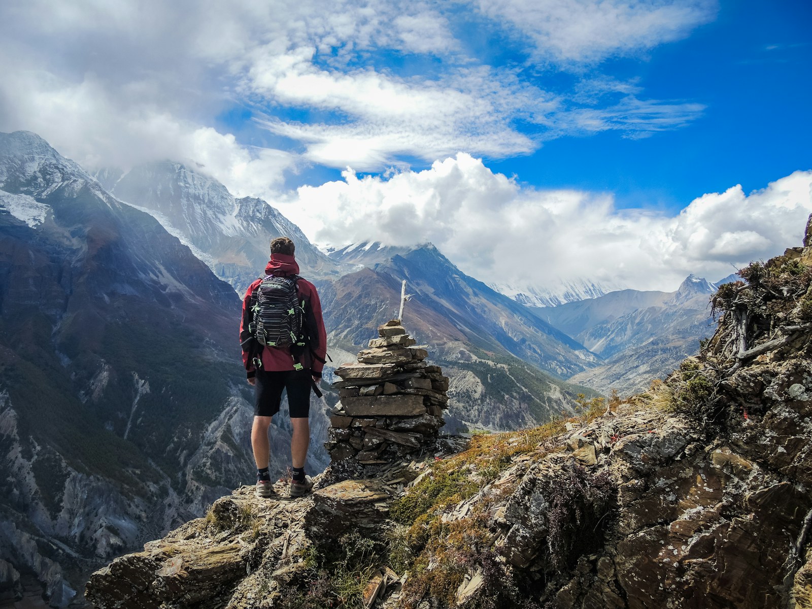Traveler standing in mountain scenery